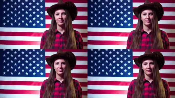 一位以美国国旗为背景，头戴牛仔帽的长发女子微笑着看着画面