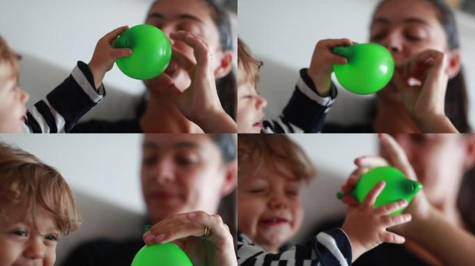 妈妈和孩子一起玩，妈妈给宝宝放气气球挑逗