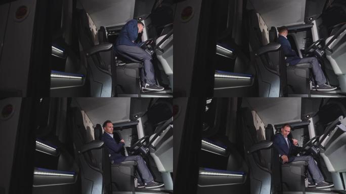 私人教练操作员穿着西装进入公共汽车，坐在机舱里并系好安全带。