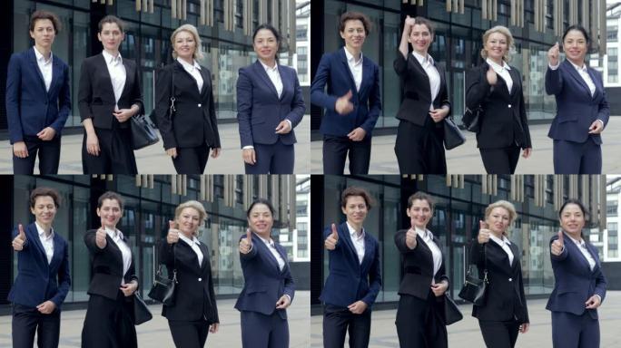 开心自豪的职业女性团对着镜头翘起大拇指站在办公室旁边，人力资源推荐投票选出最佳商业选择概念，企业女性