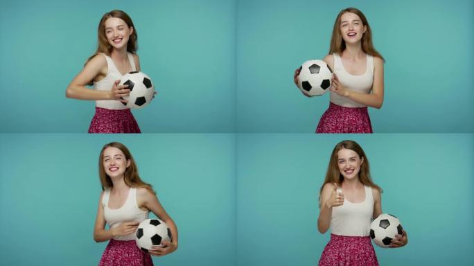 美丽的女孩手里拿着足球跳舞，看着最喜欢的体育比赛，为胜利欢呼
