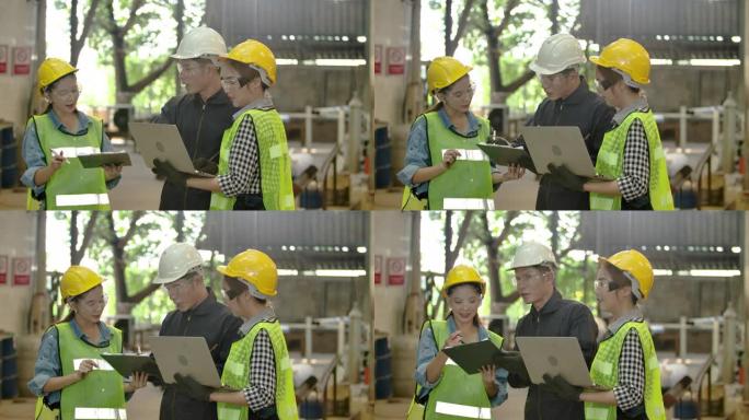 团队工程和工人使用笔记本电脑在重工业制造工厂工作时佩戴个人防护设备。在装配和生产线上一起谈论计划项目