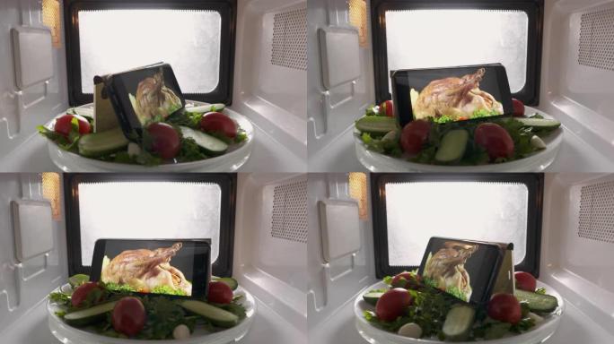 用微波炉在屏幕上播放沙拉和带烹饪食物镜头的手机。