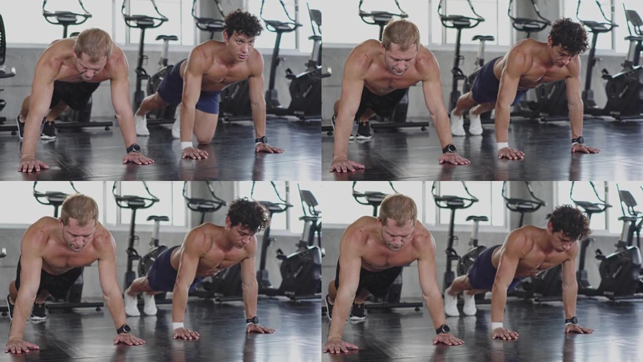 宽镜头和柔和的注意力: 两名高加索人赤裸上身的肌肉运动男子在健身房进行健身运动。锻炼训练以变得健康和