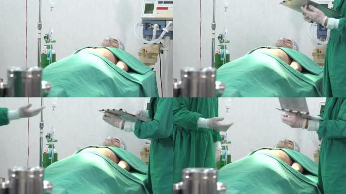 一组医生和助手正在手术室给病人做手术。