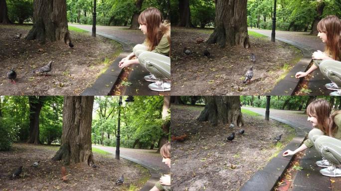 女孩在公园里喂松鼠。