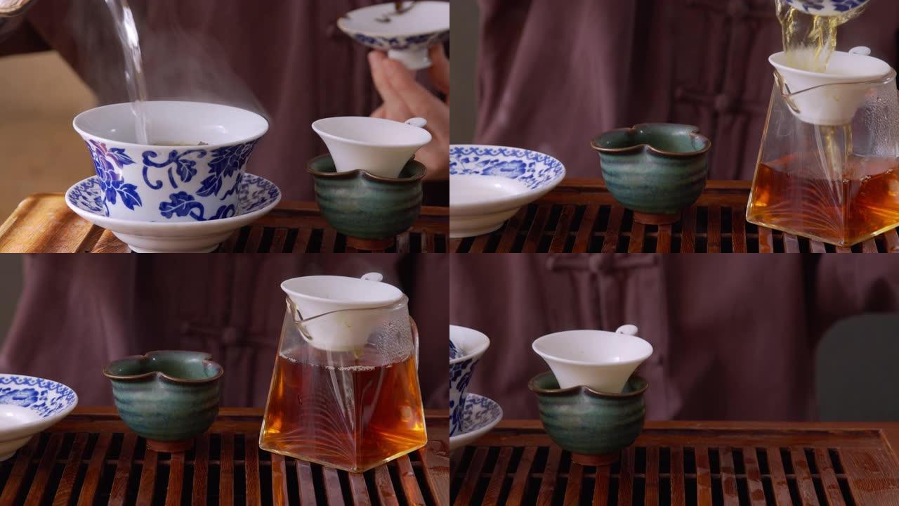 师傅往盖湾倒热水，在木托盘上冲泡绿茶。仪式上，热茶通过筛子倒入公平投手。中国茶从玻璃锅倒到碗喝。