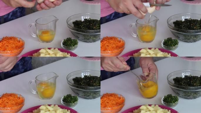 该名男子将鸡蛋敲成玻璃杯，并用叉子混合。附近有土豆，胡萝卜和栗色。用来做酸浆汤。区域食品。