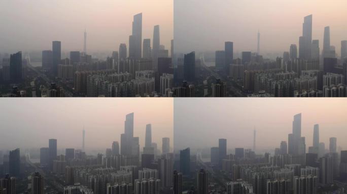 日落时飞行在广州市中心市区空中全景4k中国