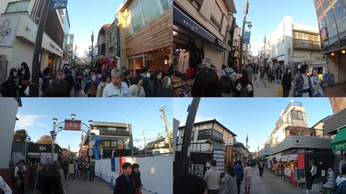 游客在镰仓市的小町商店街旅行。