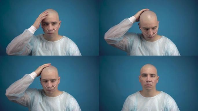 一个秃头的年轻男子带着肿瘤悲伤地看着蓝色背景上的相机。病人摸了摸他的光头。化疗导致脱发。