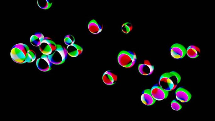 黑色背景上的3D抽象彩色球体形状球的高清视频。彩虹光折射物体漂浮在框架上。