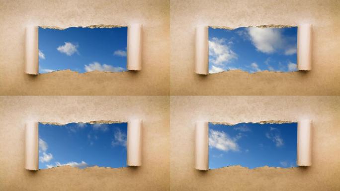 创意4k时间圈视频，在蓝天中快速移动的云，可以通过旧复古垃圾老式纸的边缘撕裂的孔看到。