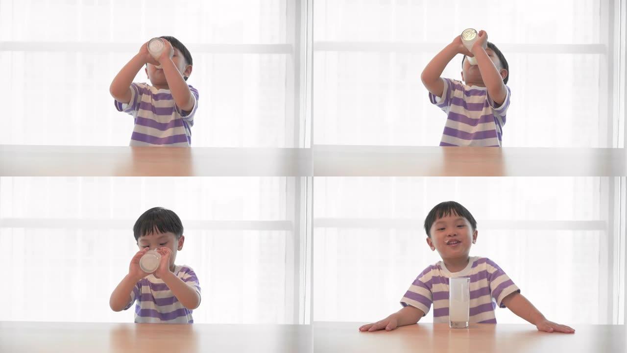 小男孩喝一杯牛奶