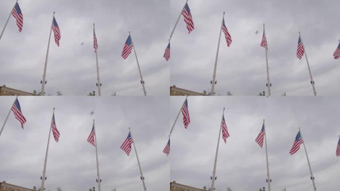 飞机在风中飘扬的美国国旗后面起飞