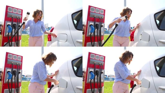 电动汽车充电站的一名妇女