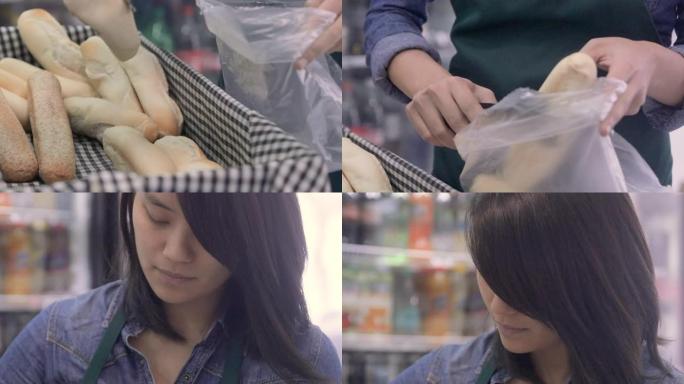 一位年轻的亚洲女售货员卖热面包的肖像