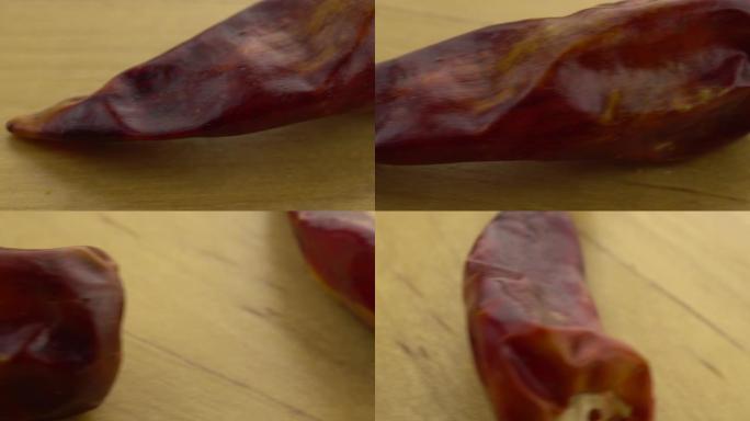 木质表面的整个辣椒。移动平台与辣椒微距拍摄。