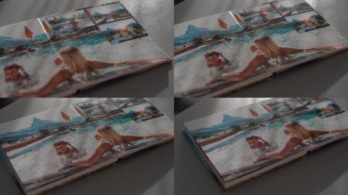 在家里的桌子上转动相册