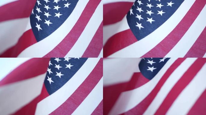 柔和的焦点特写美国旧荣耀旗帜在风中挥舞。星条旗民主、爱国、自由和独立日象征。星条旗，民族自豪感和自由