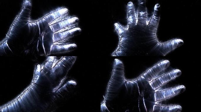 一只男性手的Kirlian光环录像显示了不同的符号和动作