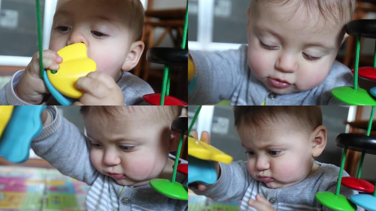 蹒跚学步的婴儿将玩具放在嘴里出牙并发现世界