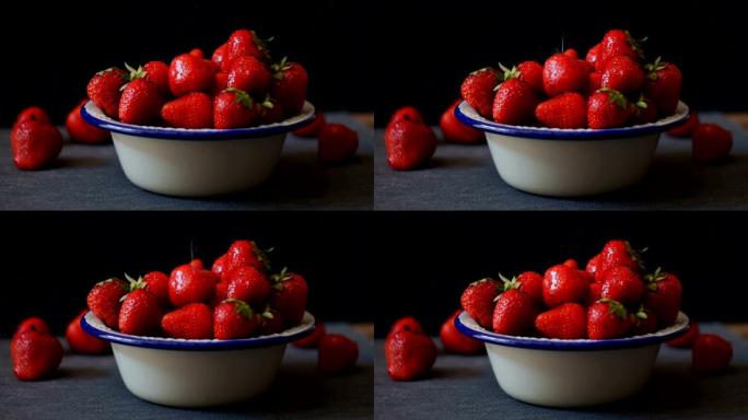 新鲜草莓。深色背景上的草莓。无缝电影视频
