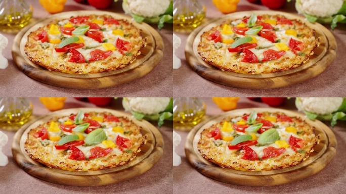 罗勒叶落在健康的素食花椰菜披萨的顶部