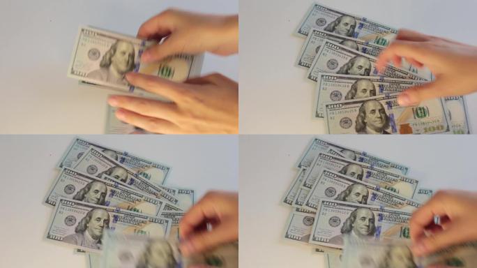 100美元钞票中的大量现金，在白色背景上数钱