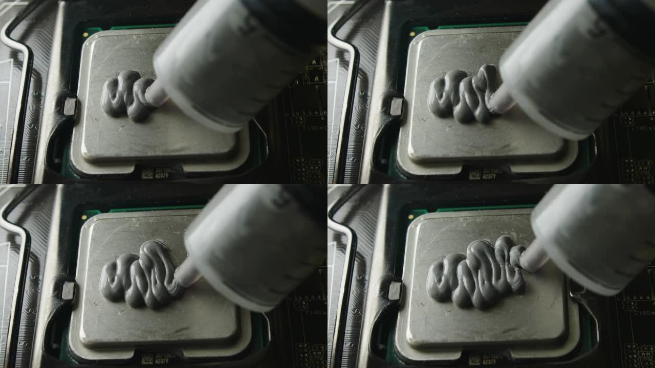 建立计算机概念。在中央处理器上涂抹导热膏的特写镜头。4k镜头。