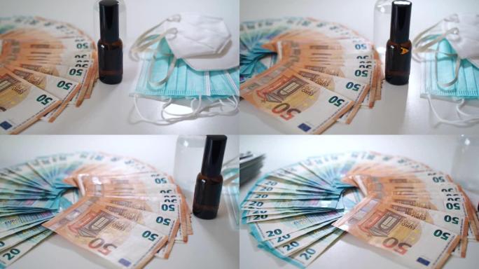 欧元纸币储蓄用于医疗保健和医疗，欧元纸币躺在白色背景附近的医疗防护口罩和小玻璃瓶中的液体补救。药品，