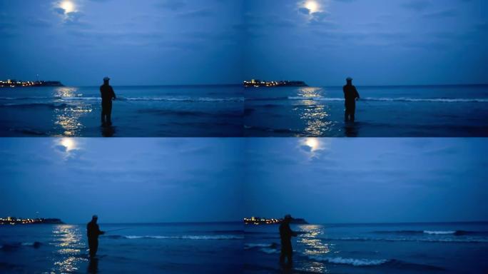 渔夫在晚上在海边靠着月亮钓鱼。