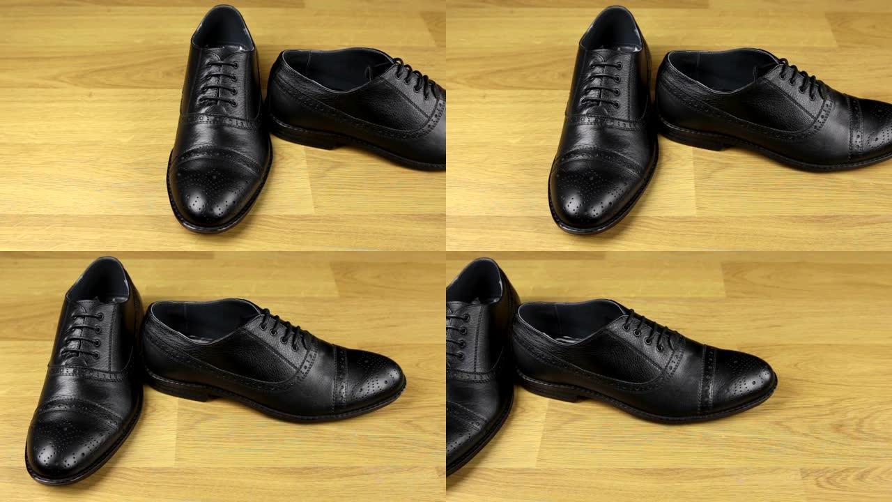 一双黑色经典系带鞋。滑块镜头。