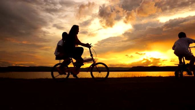 日落湖母子骑自行车运动，慢动作