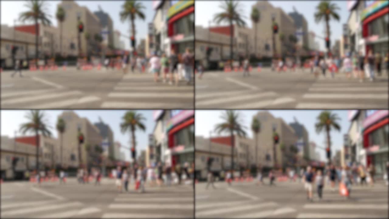 美国加利福尼亚州好莱坞大道洛杉矶星光大道。佩达斯德教徒在街道的十字路口行走。娱乐和电影业标志性的旅游