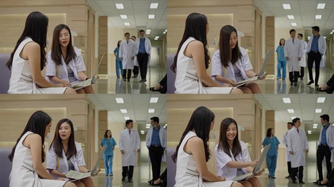 亚洲医生在医院里咨询健谈的女病人。专科医师为人民服务心灵。工作场所清洁，没有冠状病毒。结束隔离，返回