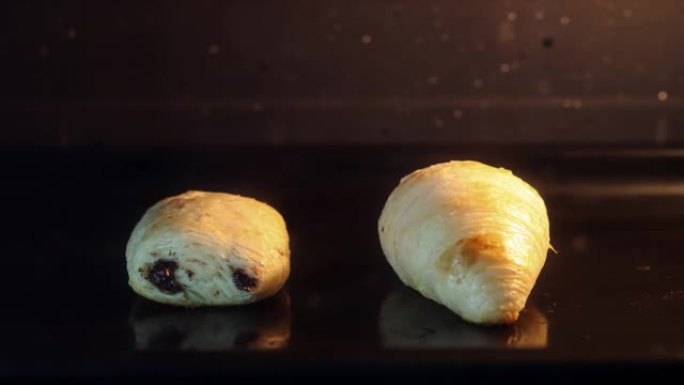 迷你疼痛au巧克力和羊角面包烤箱自制延时拍摄黑暗背景4K