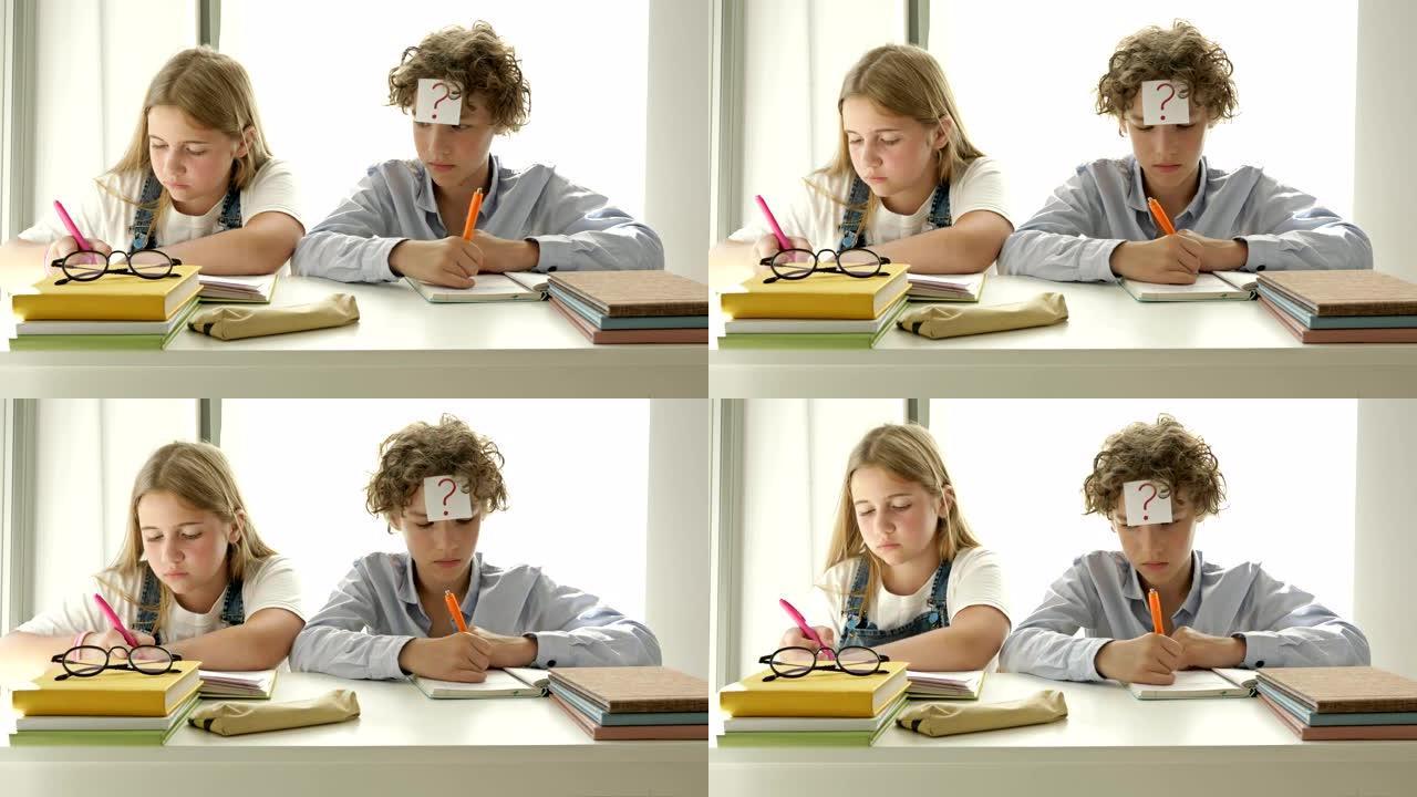 男孩和一个女孩坐在教室的同一张桌子上。女孩认真写，男孩从笔记本女孩那里注销