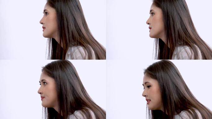 特写脸年轻的亚洲女士自信地说话和呈现。用笑脸说话交流，用手解释。