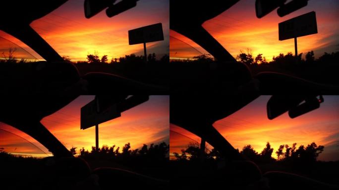 天空中日落背景下的汽车运动。