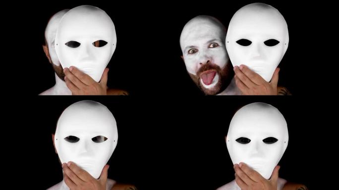一个哑剧演员摘下了白色的剧院面具。黑色背景上的男人