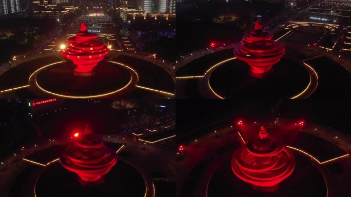 青岛市夜间照明著名纪念碑广场空中全景4k中国
