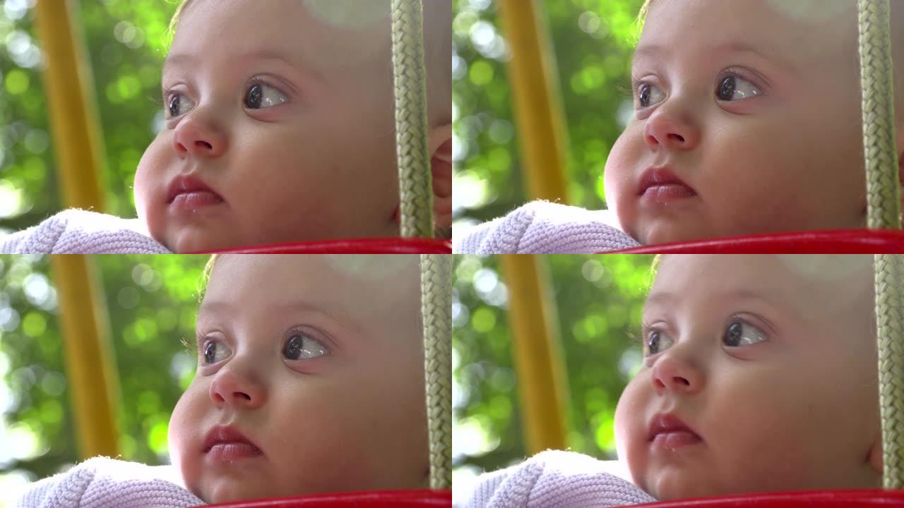 可爱婴儿脸部肖像户外婴儿特写观察