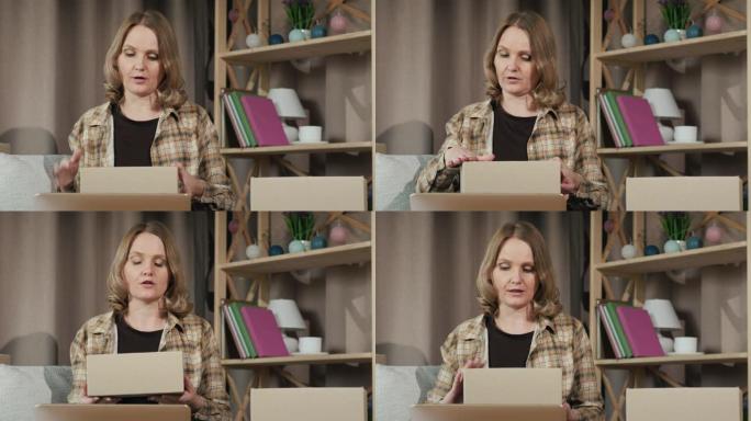 一位女性博客作者将她的产品展示给笔记本电脑相机