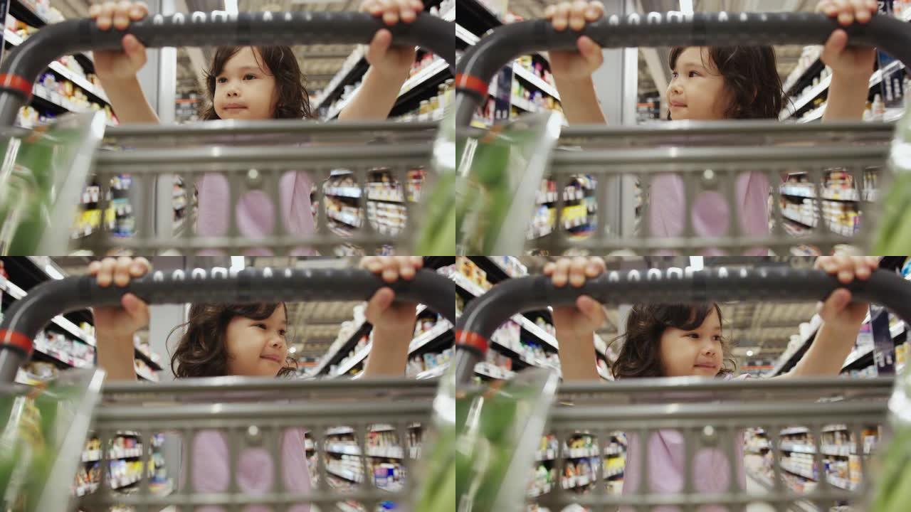 一个年轻女孩在超市里快乐地推着购物车的特写镜头