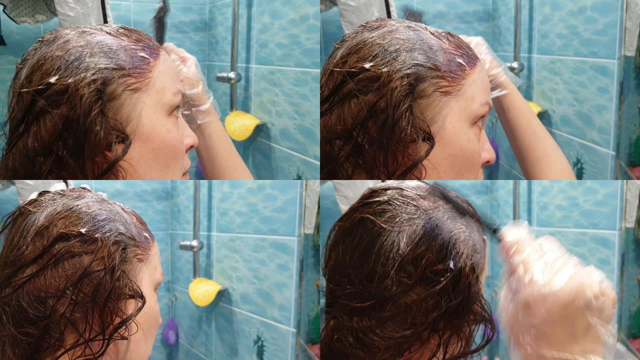 一位年轻的红发女人自涂头发，在家护发，在美容院省钱
