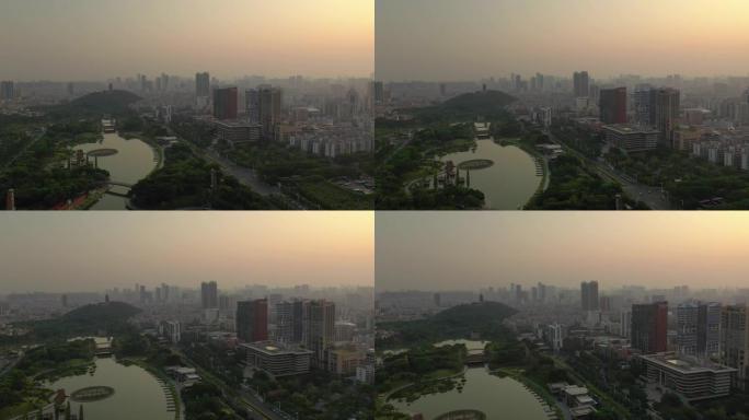 日落时间佛山市中心著名公园河滨湾空中俯拍全景4k中国