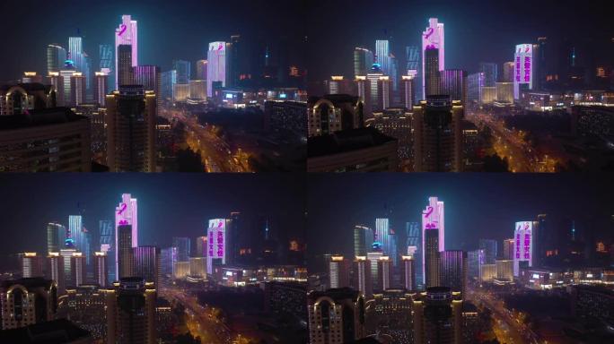 青岛市夜间照明市中心街道空中全景4k中国
