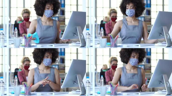 4k视频女商人在办公室戴着防护口罩，新型冠状病毒肺炎期间使用洗手液