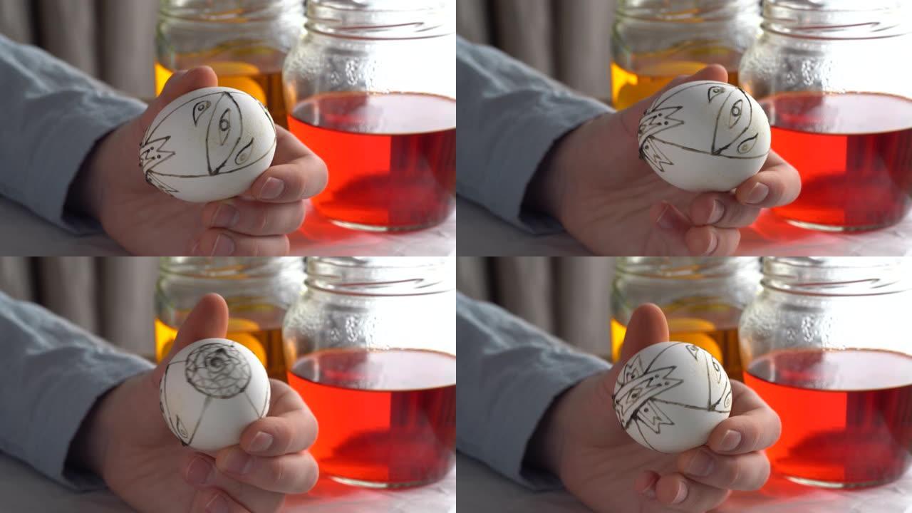 艺术家用传统蜂蜡绘画技术旋转手绘复活节彩蛋
